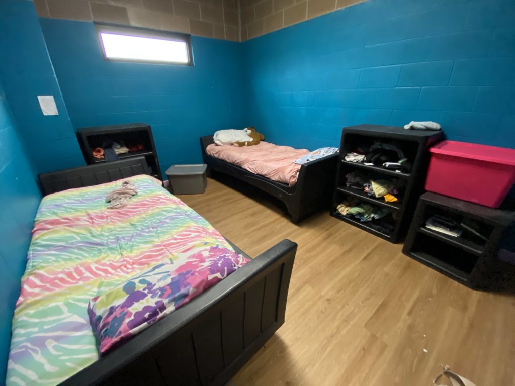 A photograph of a bedroom at the facility.