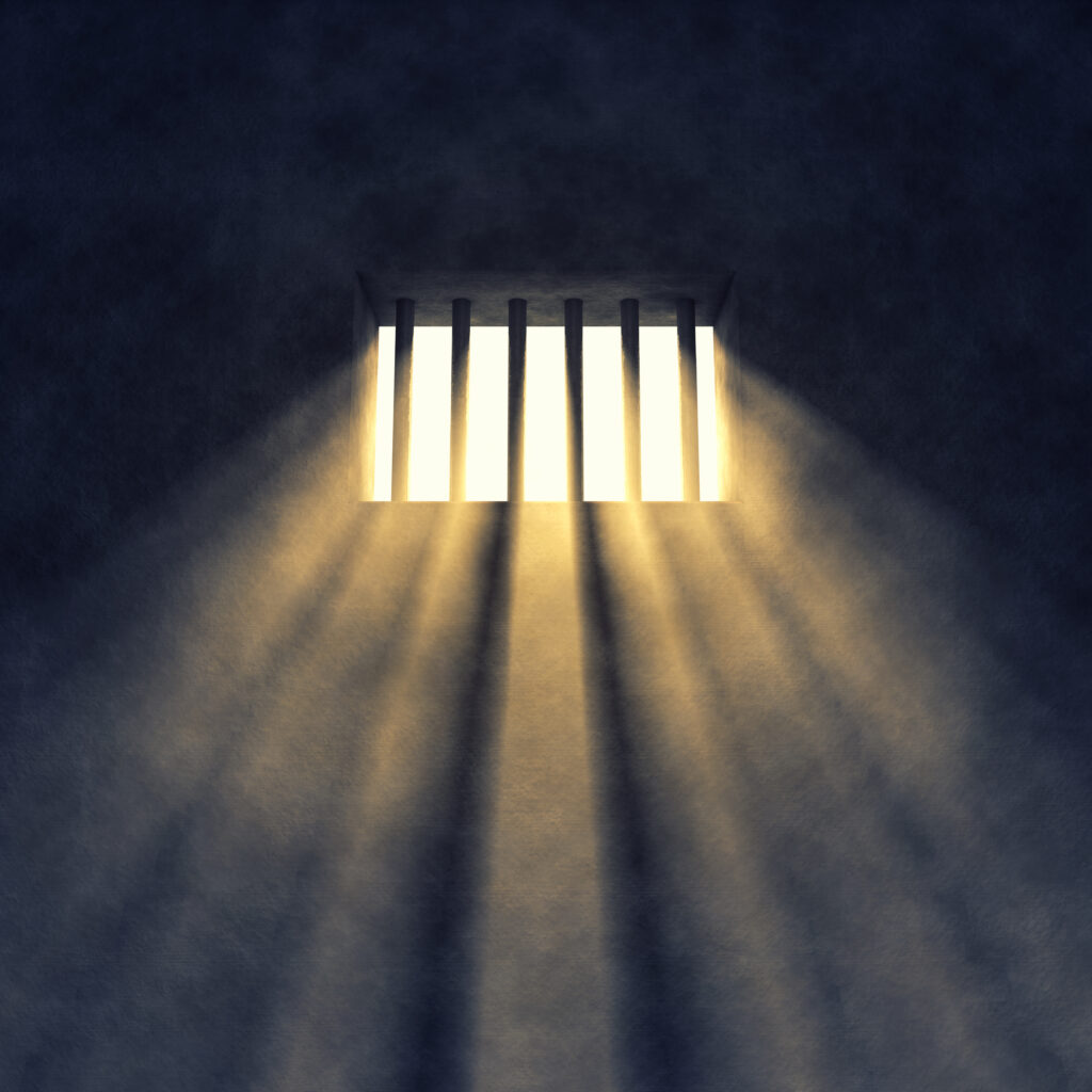 Prison cell interior , sunrays coming through a barred window