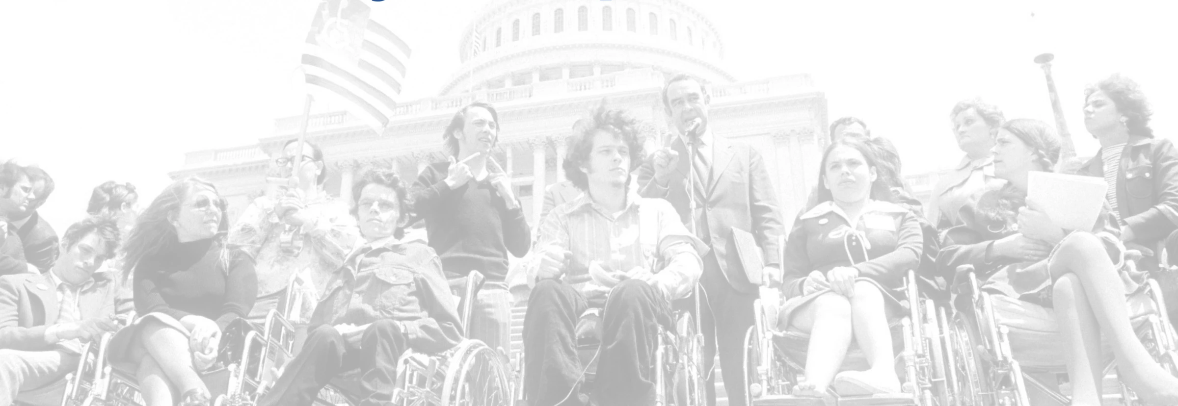 Individuals with disabilities rallying in front of the capitol. 